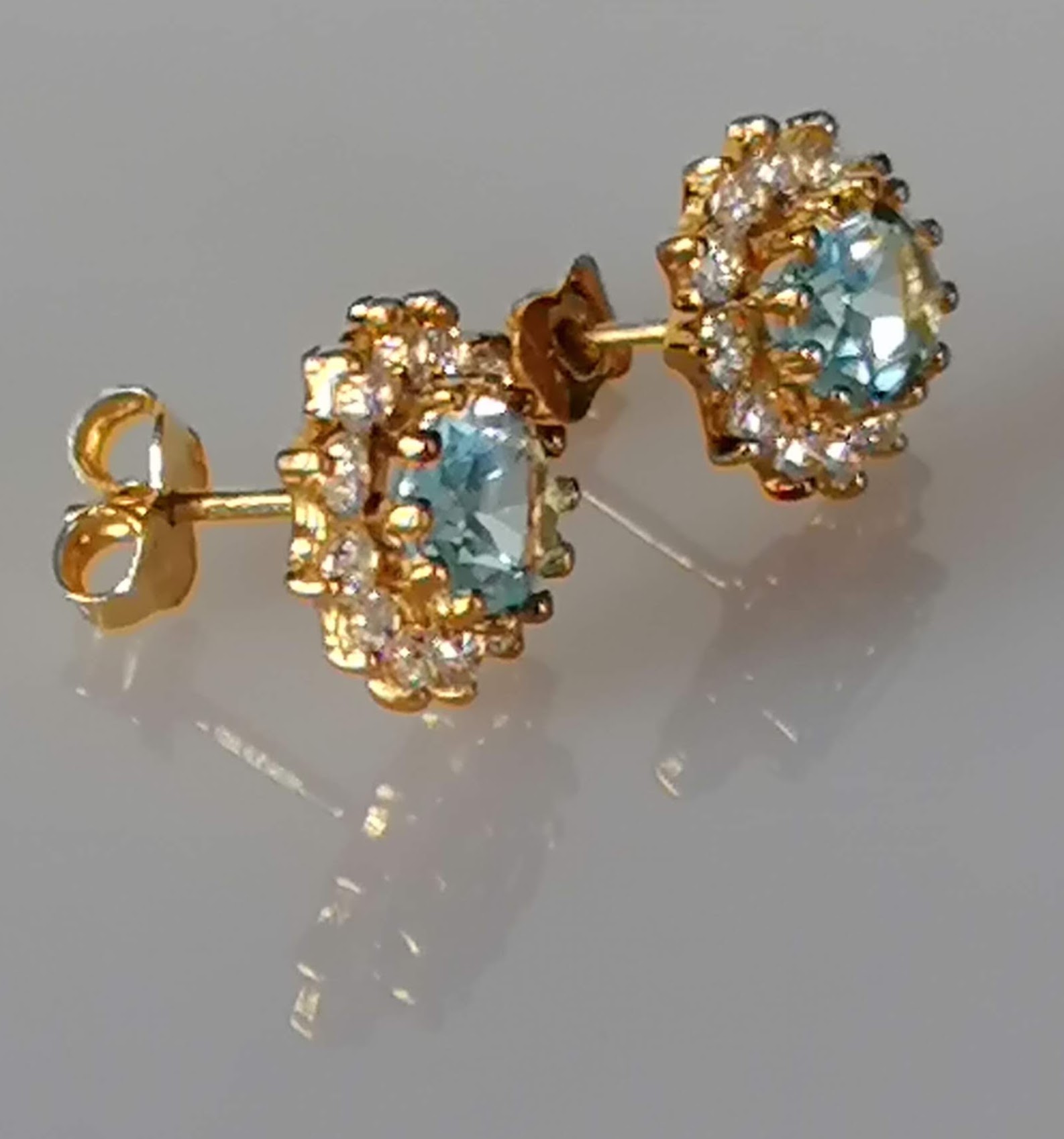 An oval blue topaz, 7 x 5mm, on white gold ring with cubic zirconia decoration to shoulders, size L, - Image 5 of 6