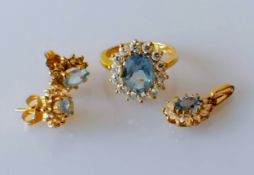 A blue topaz and cubic zirconia oval cluster ring, stone 10 x 8mm, size L, a matching pendant, stone