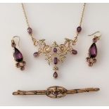 An Edwardian integrated gold chain pendant with amethyst and seed pearl decoration, stamped 9ct;