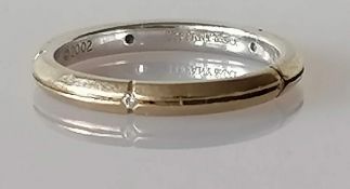 A Tiffany & Co. 18ct white gold Streamerica ring or wedding band with matt grooved finish, size N,