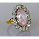 A late Victorian morganite and diamond cluster ring, the central oval-cut morganite 16.17 x 9.18 x