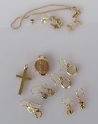 Four pairs of yellow gold earrings, a locket, crucifix and items of scrap gold, all hallmarked