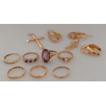 An assortment of seven 9ct yellow gold rings, some gem-set, three pairs of earrings and two pendant,