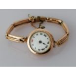 A George V rose gold-cased ladies wristwatch with roman numerals, hand missing, not in working