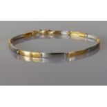 A white and yellow gold link bracelet, 75mm, stamped 750, 7.5g