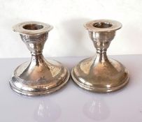 A pair of weighted Edwardian silver dwarf candlesticks, 8 cm h, by Walker & Hall, Sheffield, 1910,