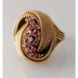 An Italian gold wire knot ring with garnet and diamond decoration, size P, unmarked, tests for 18ct,