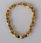 An 18ct yellow gold fancy-link bracelet, 19 cm, hallmarked, 12g