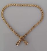 A 9ct yellow gold fancy-link necklace with integrated bow pendant and ruby decoration, hallmarked,
