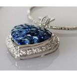 A heart-shape sapphire encrusted pendant, mystery-set, 17 x 17mm, on white metal and an 18ct white