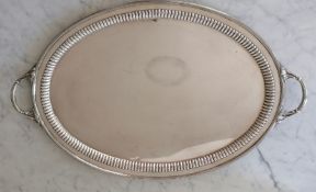 An Edwardian silver two-handled butler's tray with reeded and gadroon border by William Hutton & Son