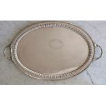 An Edwardian silver two-handled butler's tray with reeded and gadroon border by William Hutton & Son