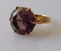 A round-cut amethyst dress ring on a yellow gold claw setting, the amethyst 15mm diameter, stamped
