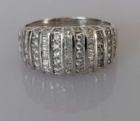 A vintage white gold and cubic zirconia dress ring in a pave setting, size O, hallmarked for Elini 7