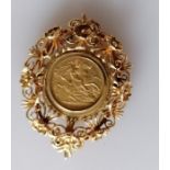 An Edwardian gold half sovereign, 1906, Sydney mint, in an elaborate 9ct gold mount