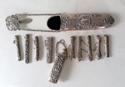 A late Victorian silver chatelaine spectacle holder, 17.5 cm, with embossed rococo design by Levi &