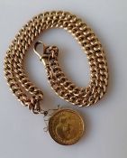 A George V gold full sovereign, 1912 in a 9ct yellow gold mount attached to a flat curb-link Albert