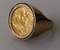 An Edwardian gold half-sovereign ring on a hallmarked 9ct yellow gold shank, 1902, size X, 12g