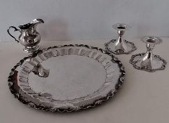 A Colombian silver circular tray with pie crust decoration and applied rococo decoration to rim, 30