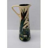 A Moorcroft Lamia pattern ewer designed by Rachel Bishop, impressed and painted factory marks to bas