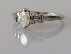 A marquise-cut diamond ring measuring 6.7 x 4.25 x 2.72mm, calculated 0.46 carat, colour/clarity K/L