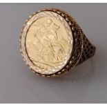 An Edwardian gold full sovereign ring, 1906, mounted on a yellow gold pierced ring