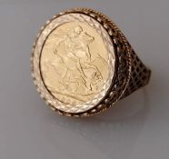 An Edwardian gold full sovereign ring, 1906, mounted on a yellow gold pierced ring