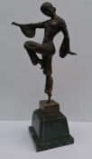 An Art Deco bronze figure of lady in a dance post on a green marble base, signed Barye, 50 cm H