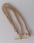 A late Victorian 9ct rose gold flat curb-link Albert chain with T-bar and double lobster clasps