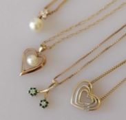 Four pendant necklaces in yellow and white gold
