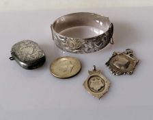 An Edwardian Birmingham silver vesta case, 1907; a silver cuff bangle by Lawson, Ward &