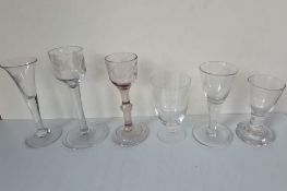 A selection of six 18th century and later lead wine, dram and other glasses