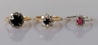 Three gem-set cluster rings set in 18ct white and yellow gold