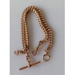 A 9ct rose gold flat curb-link Albert chain with T-bar and one lobster clasp, each link stamped