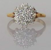 A round cluster head diamond ring set with seven round brilliant-cut diamonds, eighteen 8-cut diamon