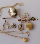 A yellow gold pendant locket on chain, another locket; a pendant swimmer on chain,
