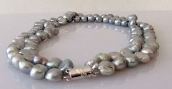 A two-row Tahitian pearl necklace comprising eighty-six baroque beads
