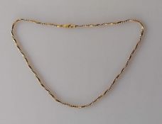 An Italian white and yellow gold twist neck chain, stamped 750, 38 cm, 10.8g