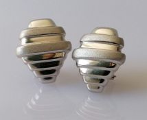 A pair of vintage white gold clip earrings with stylized, textured design, stamped 740 Errip, 5.8g