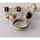 Six assorted gem-set gold rings: two late Victorian memorial rings with initials, a cameo ring