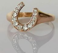 A Victorian diamond-set horse shoe ring, grain-set with thirteen old Swiss-cut diamonds,