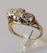 An 18ct yellow gold and platinum three-stone diamond ring in a mounted illusion setting