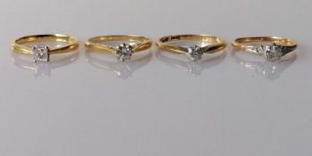 Four 18ct yellow gold-set single stone diamond rings: one set with a princess-cut diamond