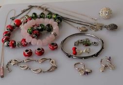 A selection of silver based gem-set jewellery to include pendant neck chains, rings, bracelets