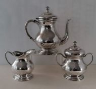 A Colombian silver three-piece coffee set of plain baluster form, each on a stepped foot, stamped 0.
