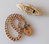 A late Victorian gold memorial brooch with seed pearl and garnet decoration, 4.5 cm