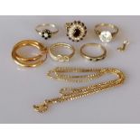 An assortment of five 9ct yellow gold gem-set rings and a pair of earrings, various sizes