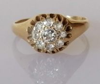 An Edwardian diamond cluster ring, set with nine old mine-cut diamonds,