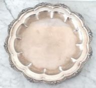 A large Colombian silver circular tray with pie crust decoration and applied floral border, 50 cm di