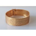 An Italian-style yellow metal honeycomb reversible cuff bracelet, 22mm x 195mm, 61.75g